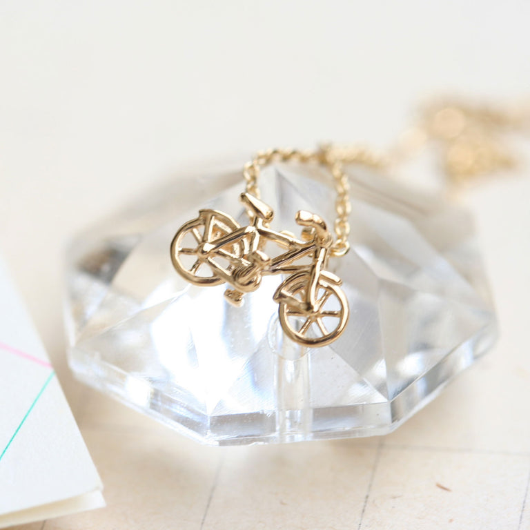 Gold bicycle necklace