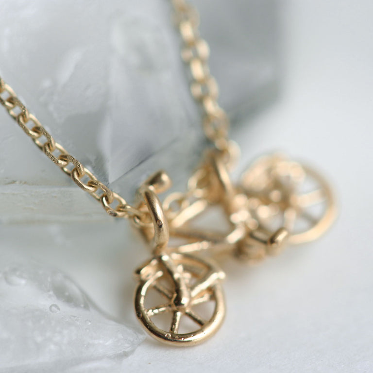 Gold bicycle necklace